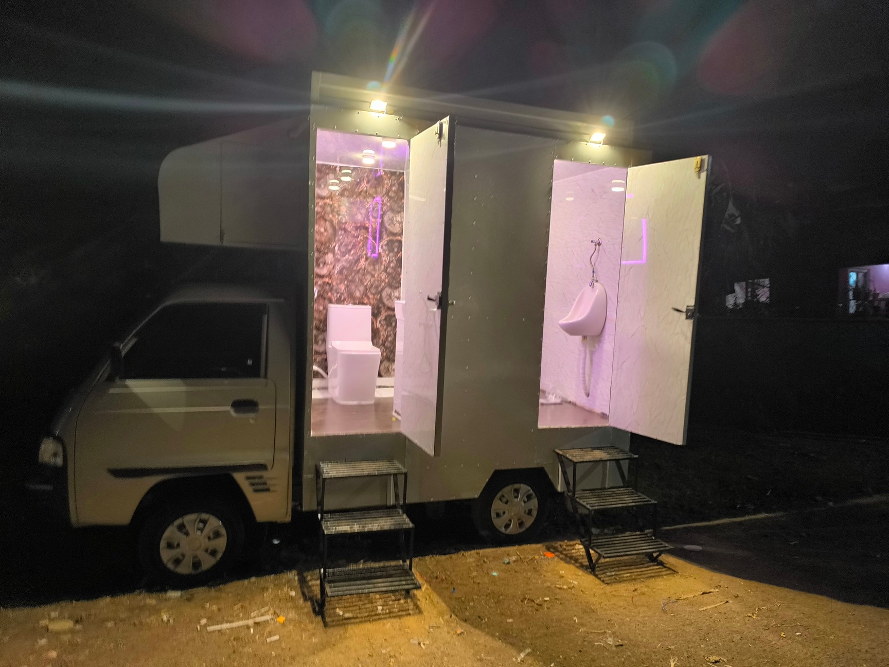 Air-conditioned mobile toilet van with both cabins open at night