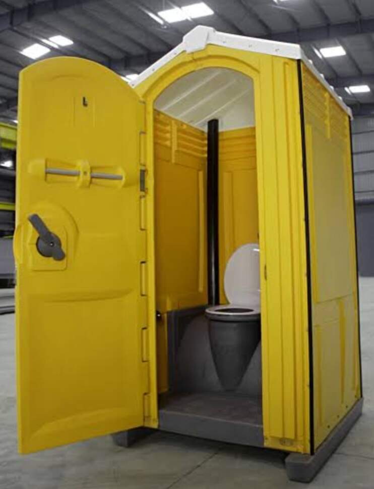 Open yellow portable toilet cabin showing clean interior